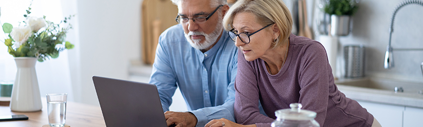 a couple reviewing options online